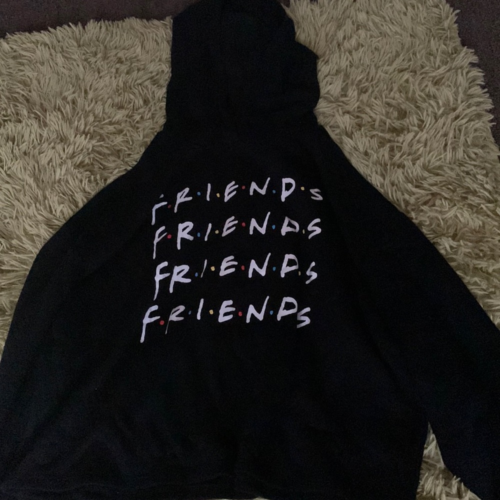 A crop top sweater not that cropped.A size small in girls.